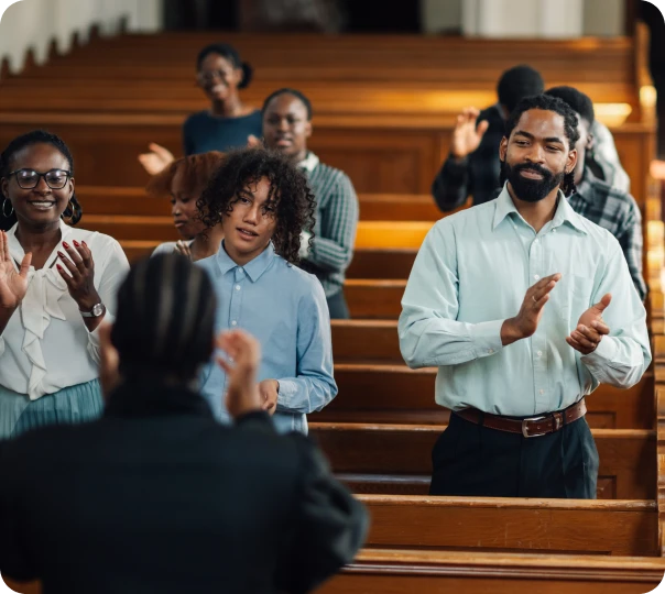 Congregation applauding during worship